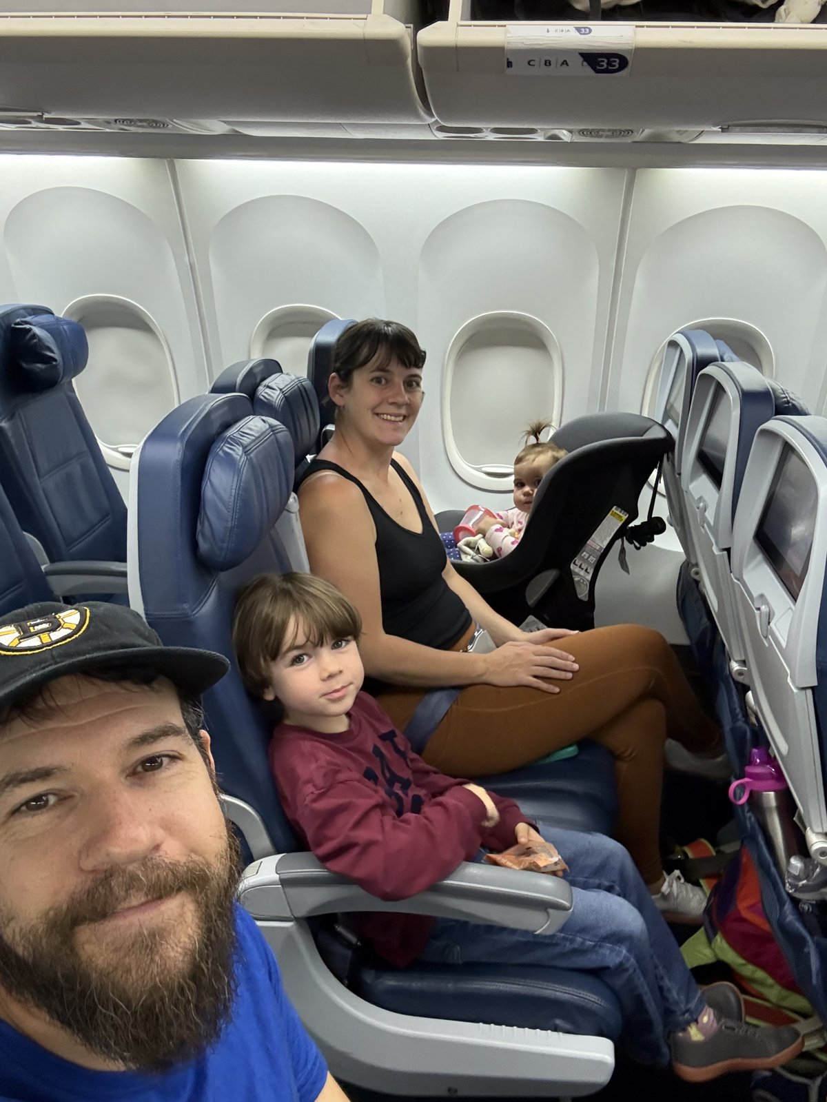 Family flying with a Cosco Scenera Next car seat on the plane